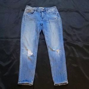 Distressed blue jeans